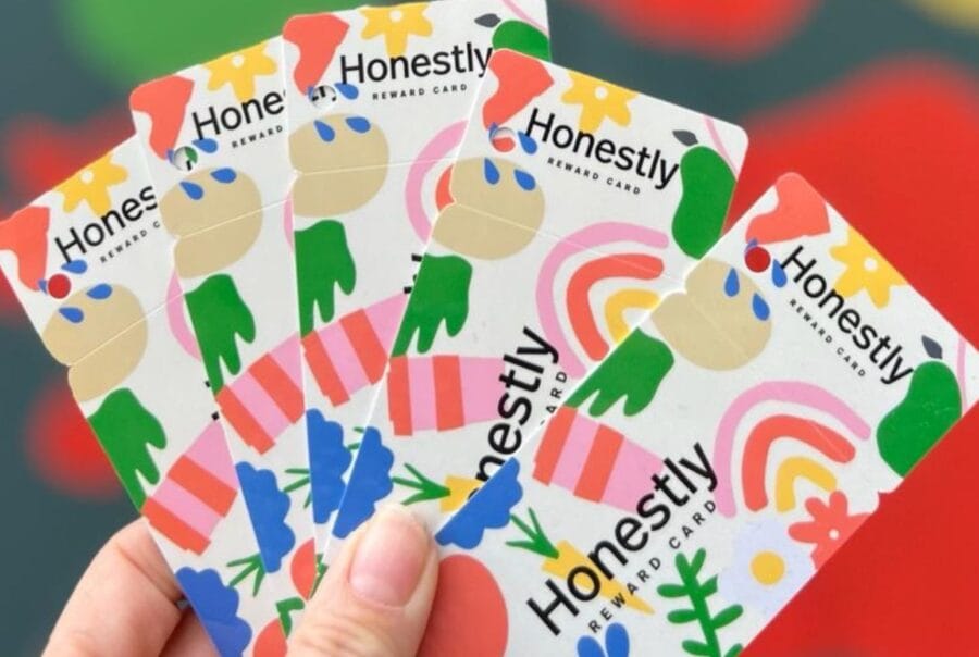 hand holding fan shape of loyalty cards