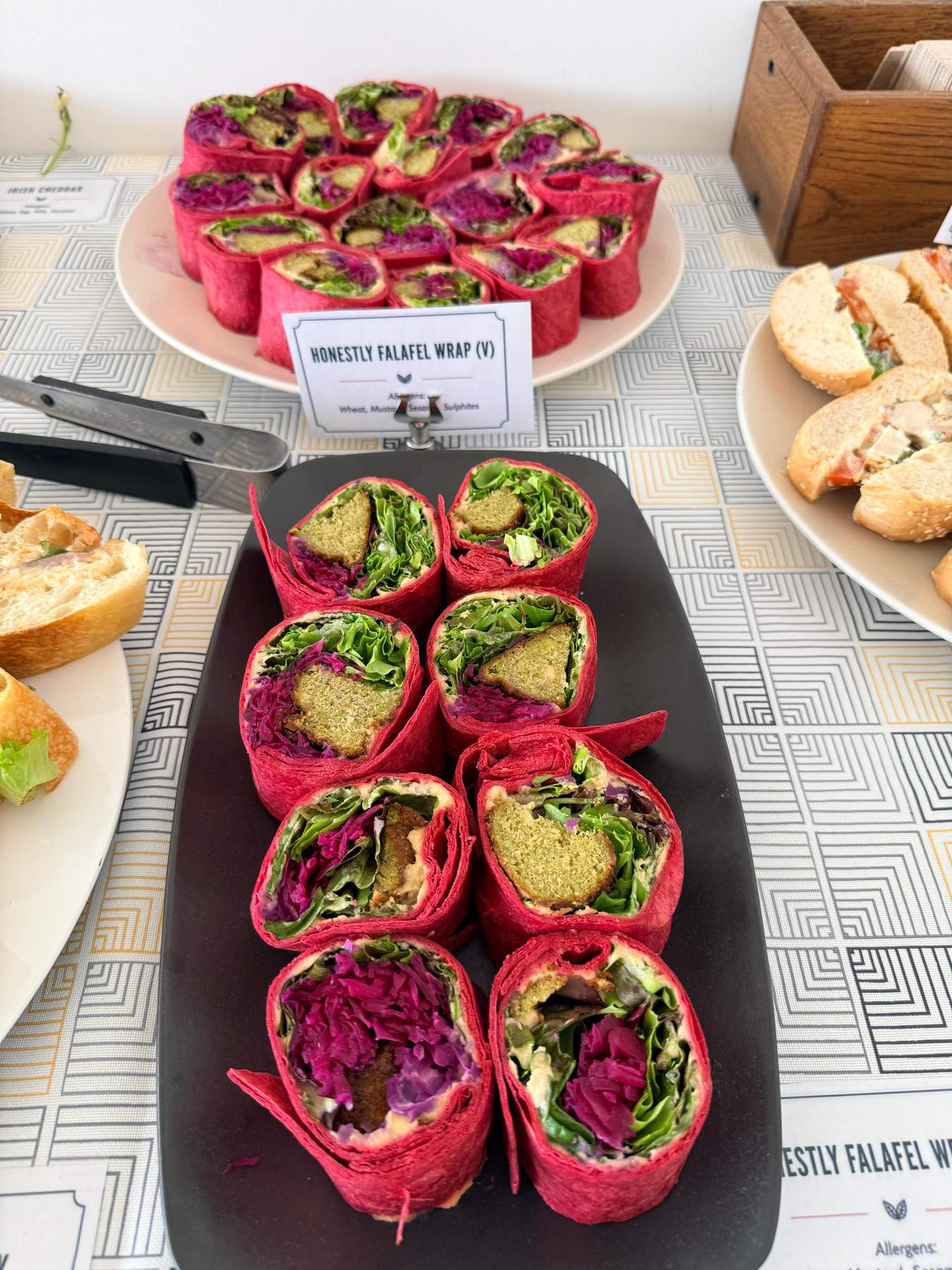 Honestly falafel wraps and sandwich platters set out for a catered lunch