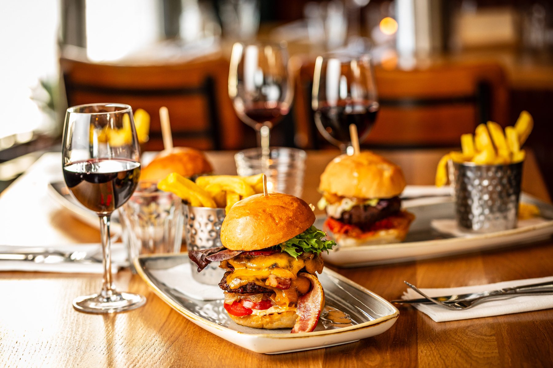 Honestly burgers and chips served with wine in the restaurant at Strandhill