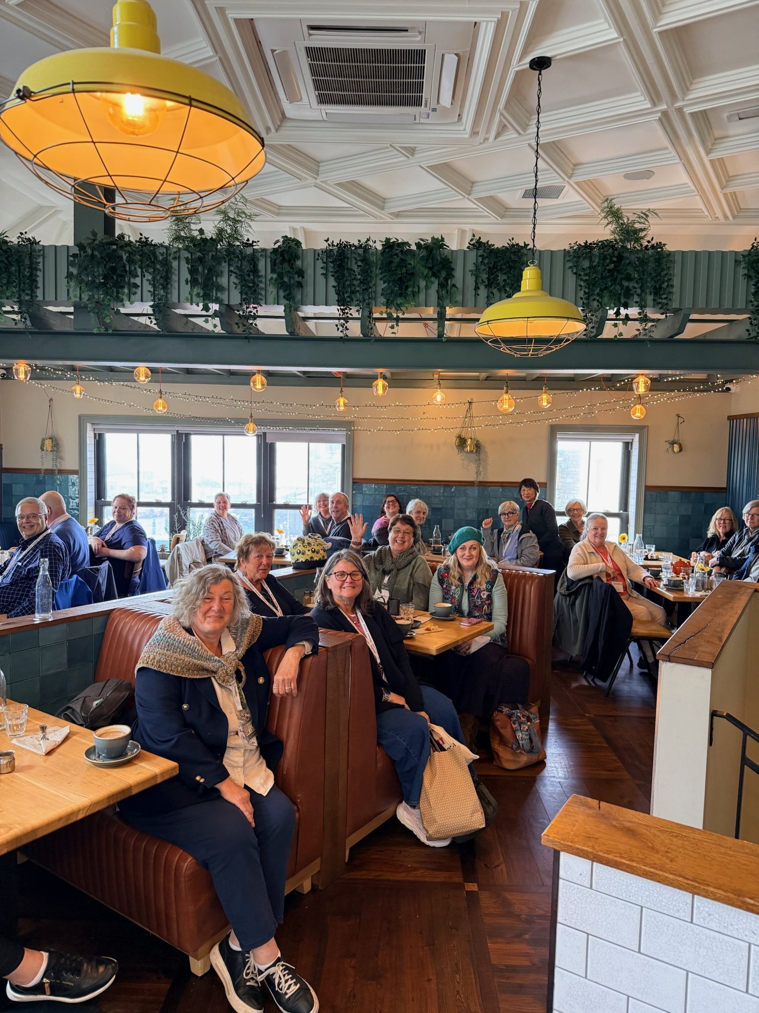 The touring group seated together in the private upstairs room at Honestly Strandhill